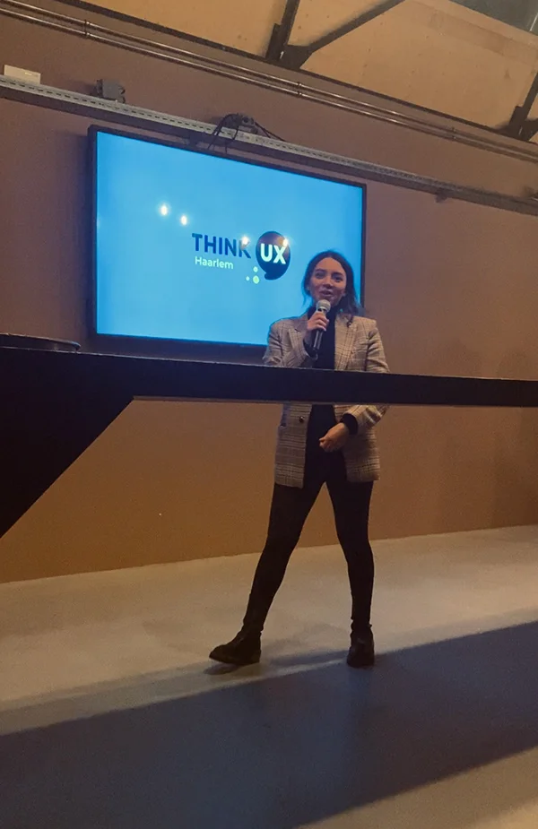 Nicole in front of the crowd presenting